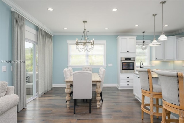 dining area featuring crown molding, a wealth of natural light, and an inviting chandelier