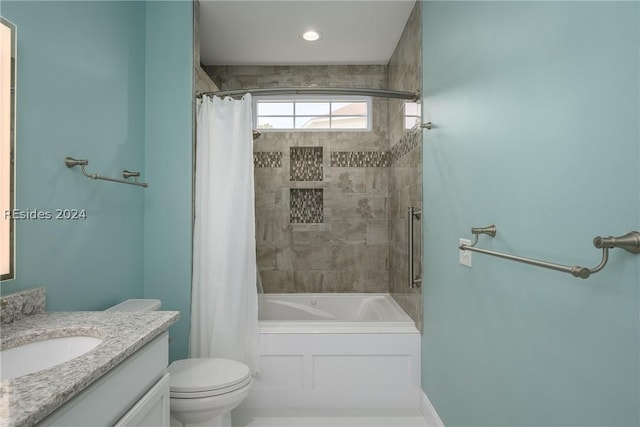 full bathroom with vanity, shower / bath combination with curtain, and toilet