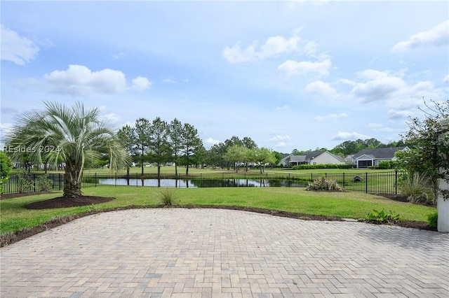 surrounding community featuring a yard and a water view