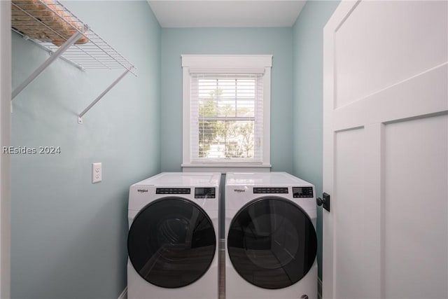 clothes washing area with washing machine and clothes dryer