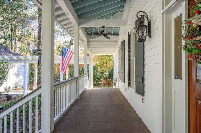 view of patio featuring ceiling fan and a porch