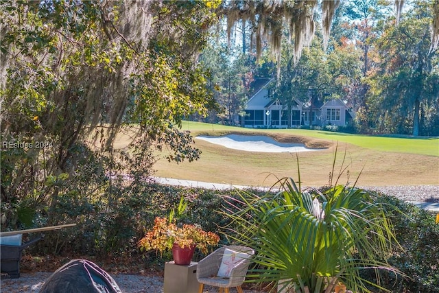 view of pool featuring a lawn