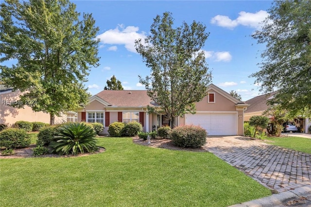 single story home featuring a garage and a front yard