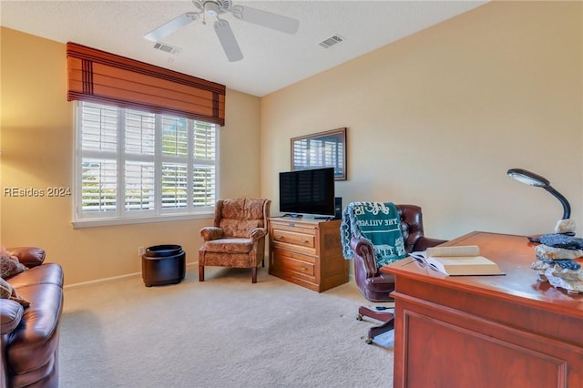 home office featuring light colored carpet and ceiling fan