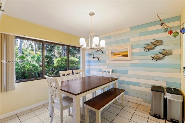 tiled dining space with a notable chandelier