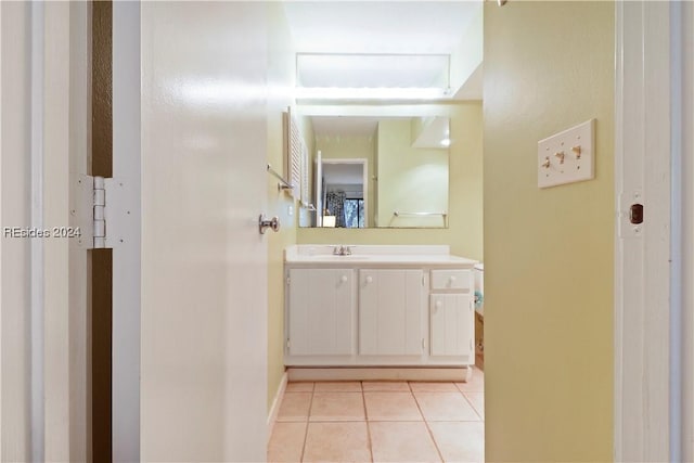 bathroom with tile patterned floors and vanity