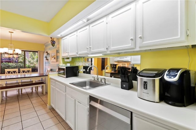 kitchen featuring white cabinetry, sink, light tile patterned floors, and stainless steel appliances