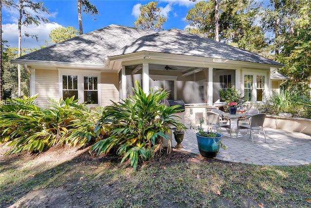 rear view of property featuring a patio