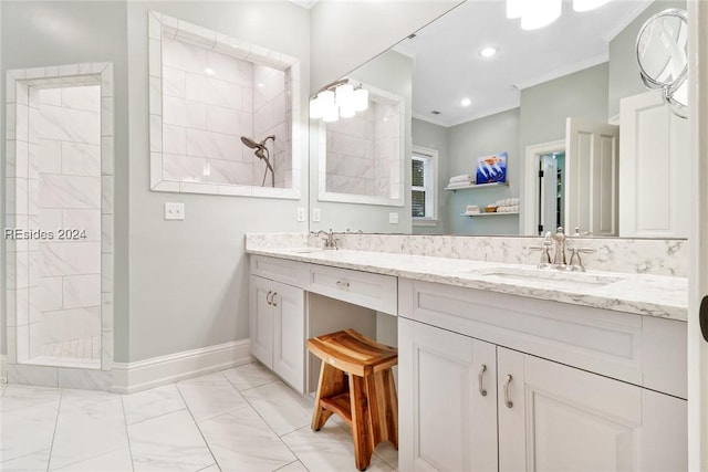 bathroom featuring ornamental molding, a tile shower, and vanity