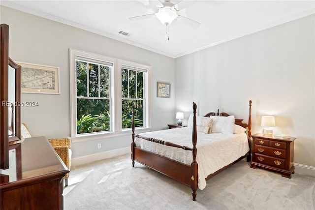 bedroom featuring crown molding, ceiling fan, and light colored carpet