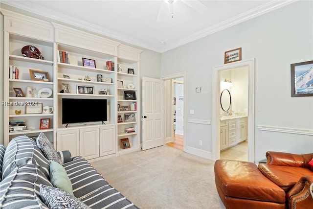 carpeted living room featuring crown molding and ceiling fan