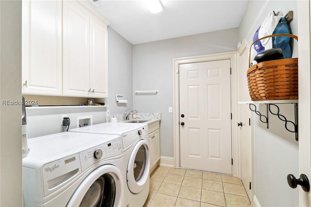 laundry room featuring washer and dryer, light tile patterned floors, sink, and cabinets