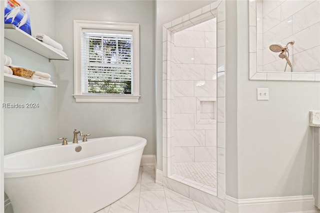 bathroom featuring independent shower and bath