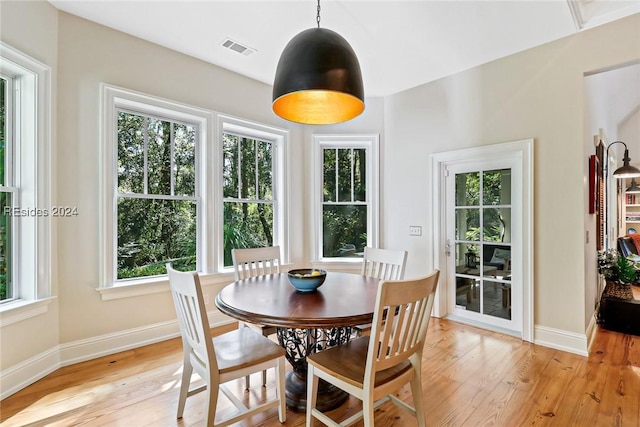 dining space featuring light wood-type flooring