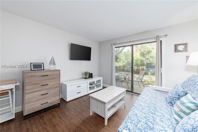 living room with dark hardwood / wood-style flooring