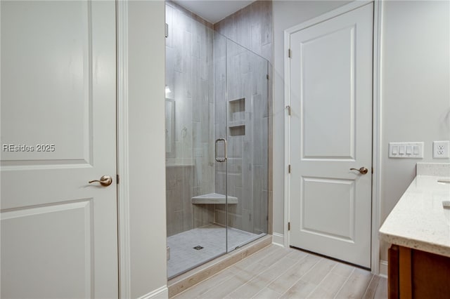 bathroom with vanity and an enclosed shower