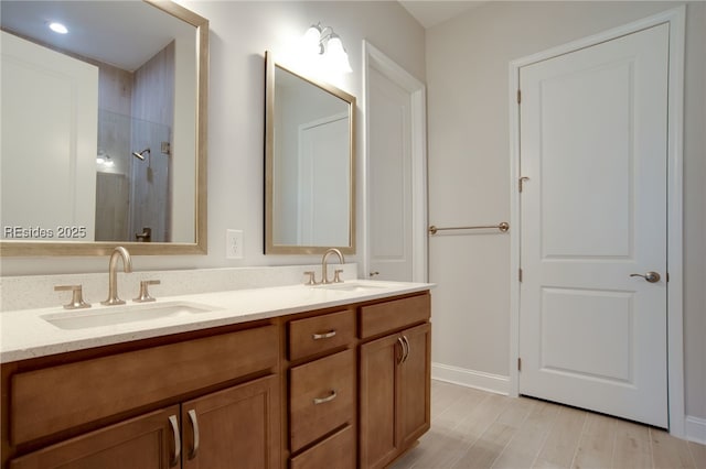 bathroom with vanity and a shower