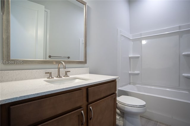 full bathroom with tile patterned flooring, shower / washtub combination, vanity, and toilet