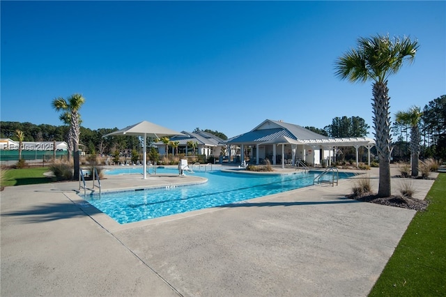 view of swimming pool featuring a pergola and a patio area