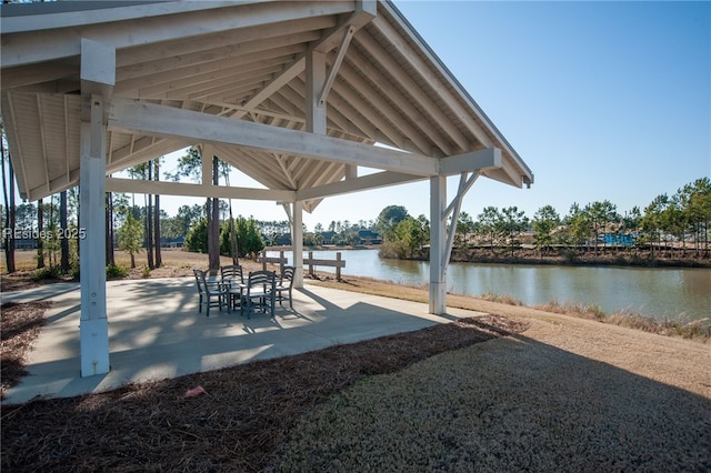 view of patio / terrace with a gazebo and a water view