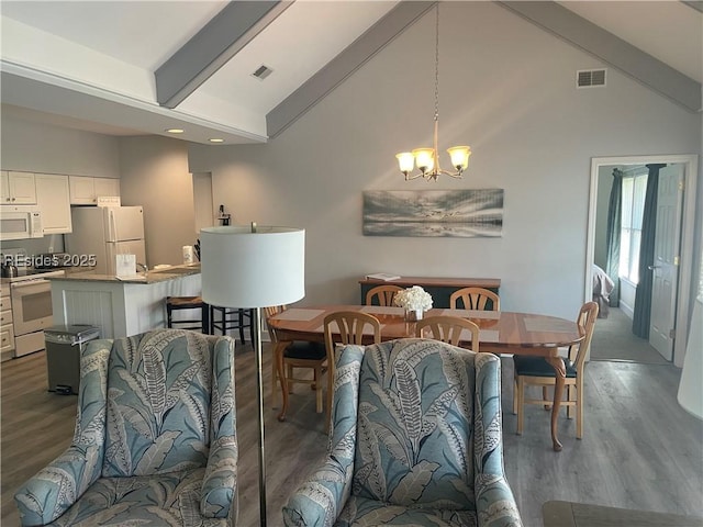 dining room featuring hardwood / wood-style floors, high vaulted ceiling, an inviting chandelier, and beam ceiling