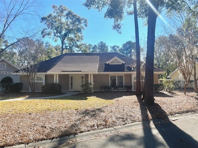 single story home featuring a front yard