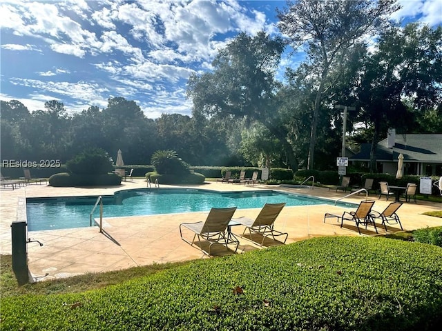 view of swimming pool with a patio area