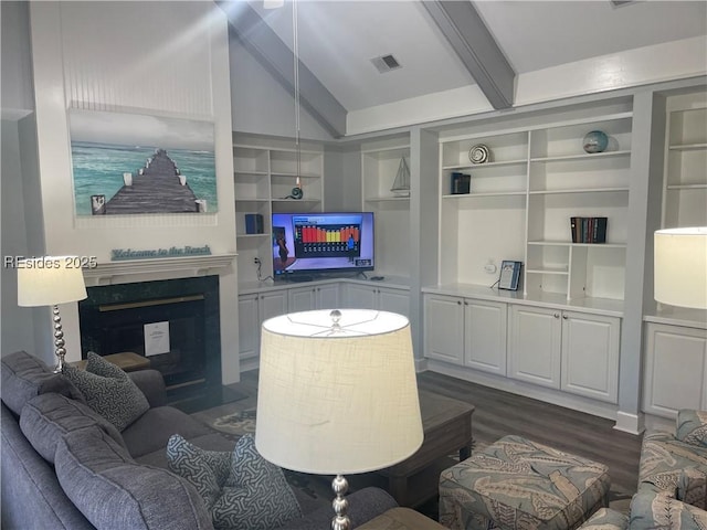 living room with built in shelves, dark wood-type flooring, and lofted ceiling with beams