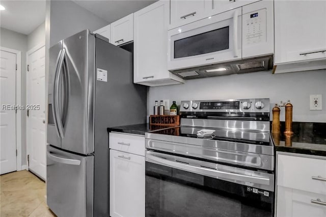 kitchen featuring white cabinetry, stainless steel appliances, and light tile patterned flooring