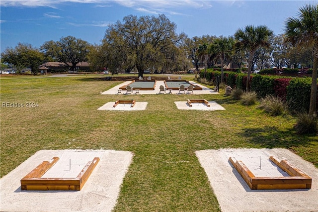 view of home's community featuring a lawn