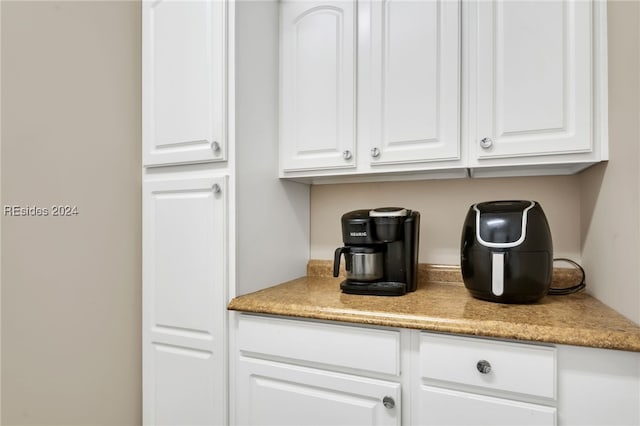 kitchen featuring white cabinetry