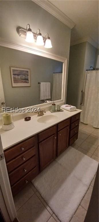 bathroom with ornamental molding, vanity, and tile patterned flooring