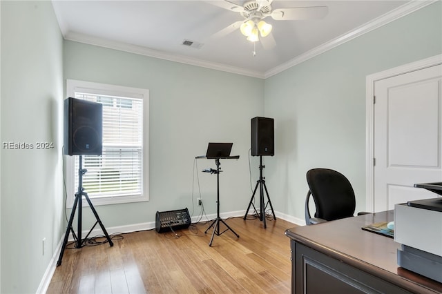 home office featuring ceiling fan, ornamental molding, and light hardwood / wood-style flooring