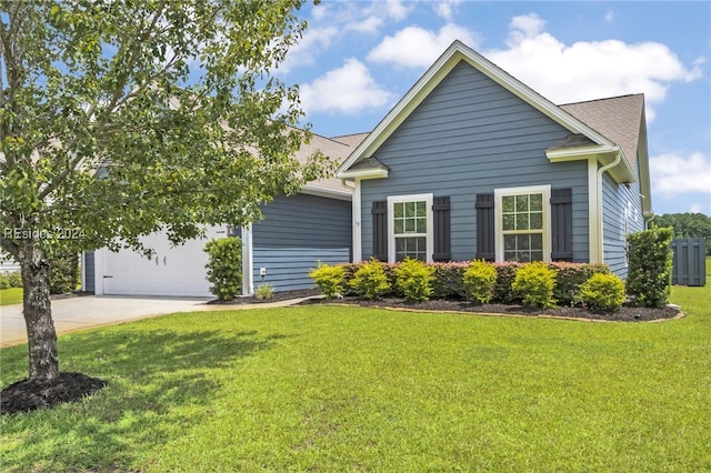 view of side of property featuring a garage and a lawn