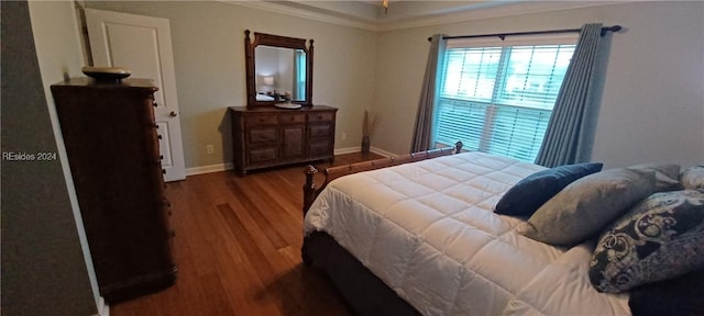 bedroom with crown molding and wood-type flooring