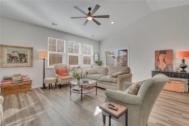 living room with vaulted ceiling, ceiling fan, and light hardwood / wood-style flooring