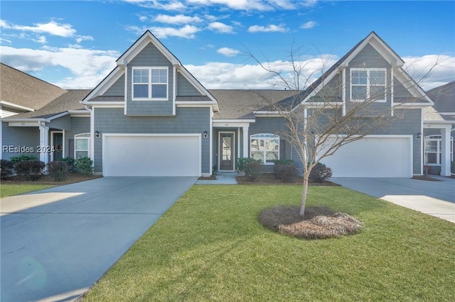 craftsman-style home with a garage and a front yard