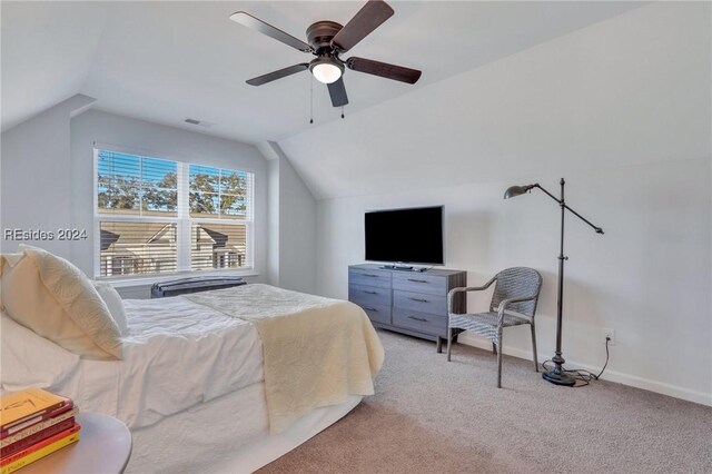 carpeted bedroom featuring vaulted ceiling and ceiling fan