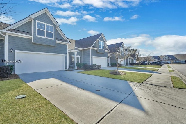 view of front of property with a garage and a front yard