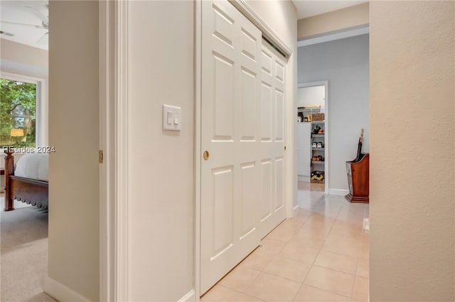 corridor with light tile patterned floors