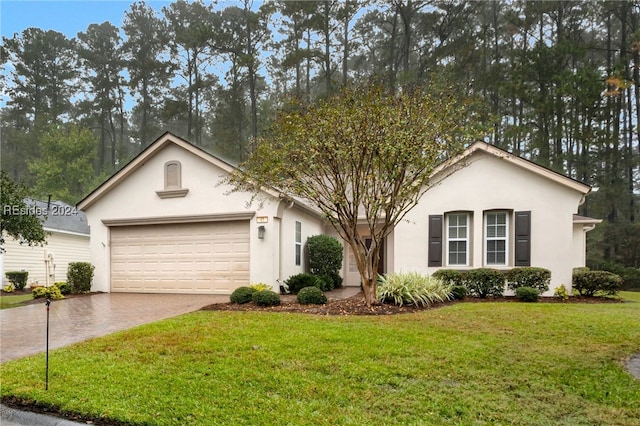 ranch-style house with a garage and a front yard