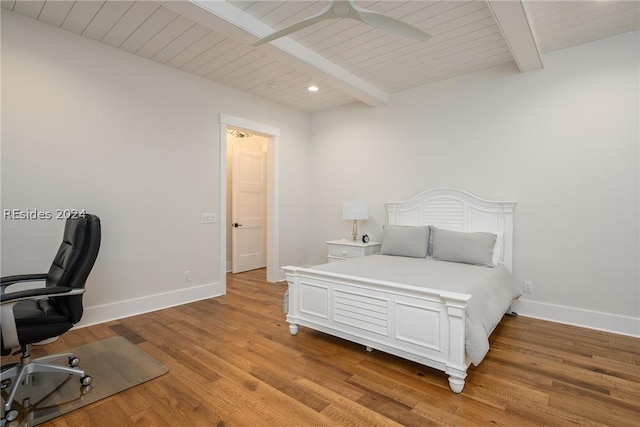 bedroom featuring beamed ceiling, ceiling fan, and light hardwood / wood-style flooring