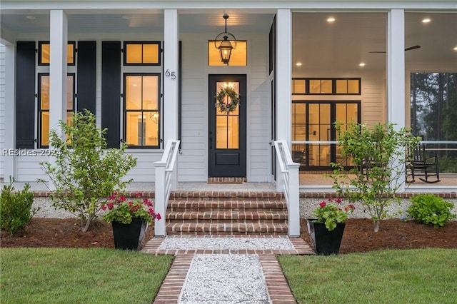 view of exterior entry with a porch