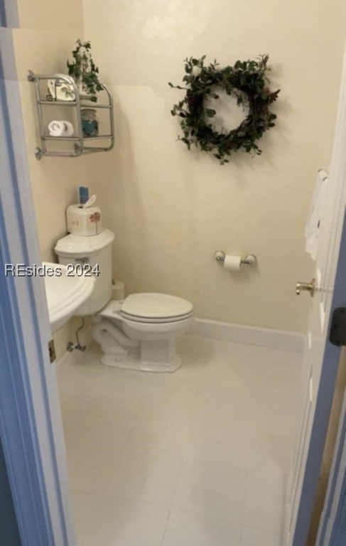 bathroom featuring tile patterned floors and toilet