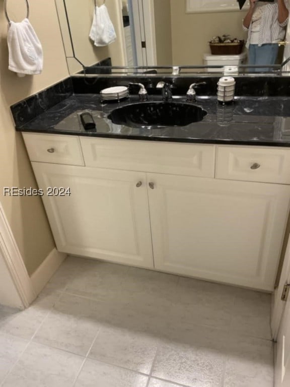 bathroom featuring tile patterned floors and vanity