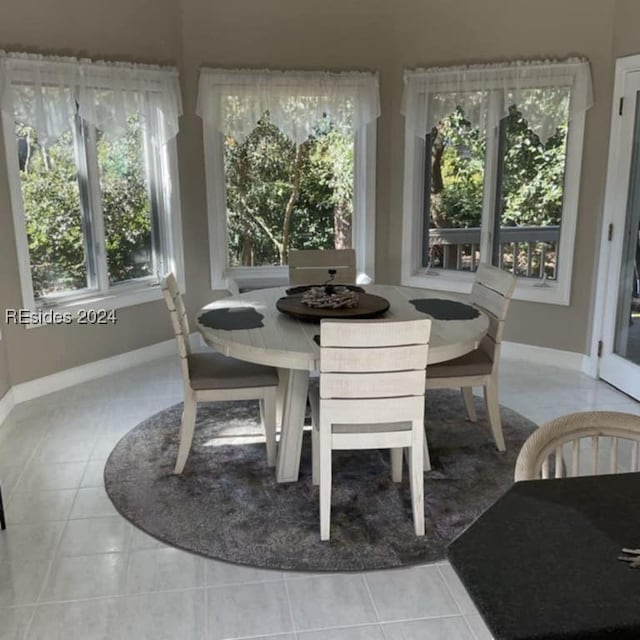 dining space with tile patterned flooring