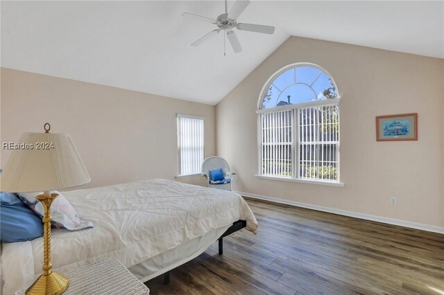 bedroom with lofted ceiling, dark wood-type flooring, and ceiling fan