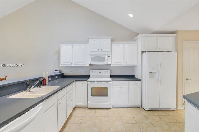 kitchen featuring sink, white appliances, vaulted ceiling, and white cabinets