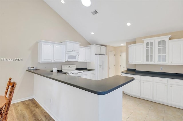 kitchen featuring white cabinetry, white appliances, kitchen peninsula, and high vaulted ceiling