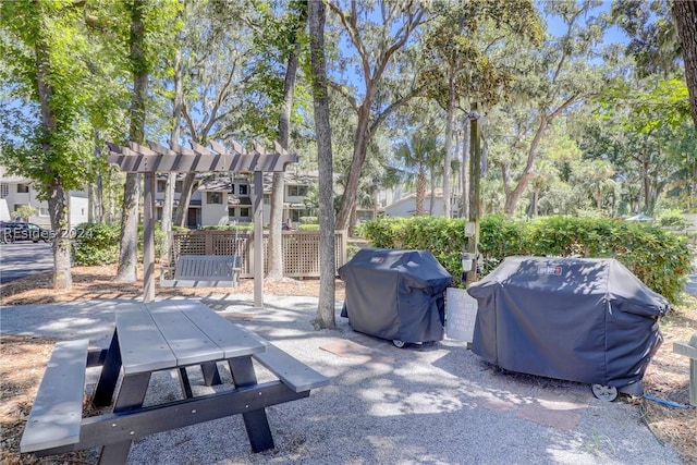 view of patio / terrace featuring area for grilling and a pergola